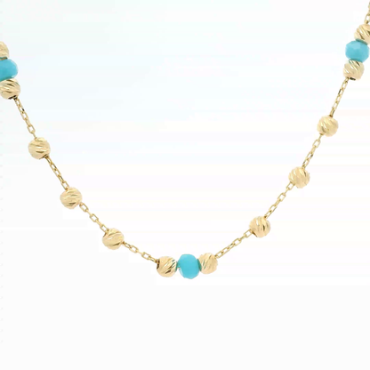 Elegante Halskette aus Gold und türkisen Perlen