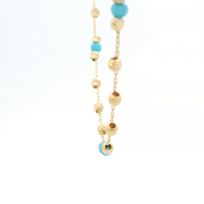 Elegante Halskette aus Gold und türkisen Perlen