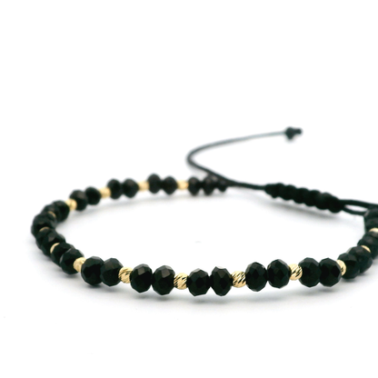 Elegantes schwarzes Armband mit 585er goldenen Kugeln